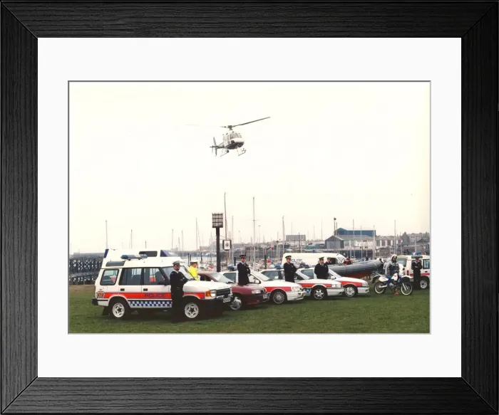 Framed Print : Police officers in their varied forms of transport - cars