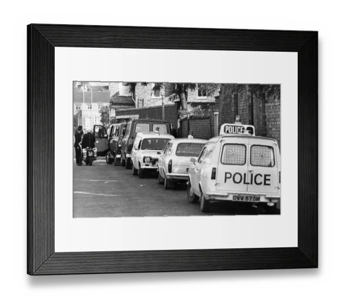 Framed Print : A line of police cars and vans in a Newcastle Street