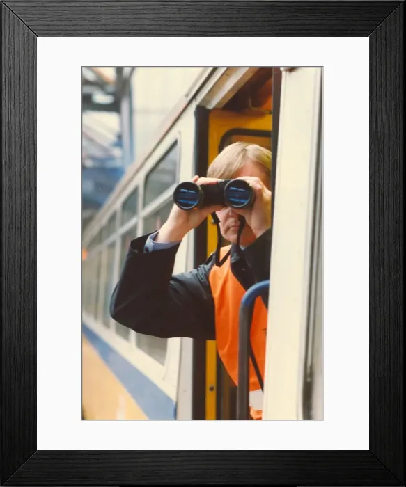 Framed Print : A transport police officer scans the tracks with his binoculars Framed Print : A transport police officer scans the tracks with his binoculars