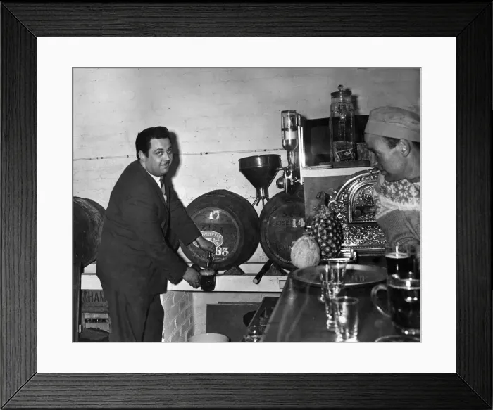 Framed Print : Mr. Don Fraser, landlord of the Wellington Hotel in Eccles now draws from the wood in his Framed Print : Mr. Don Fraser, landlord of the Wellington Hotel in Eccles now draws from the wood in his