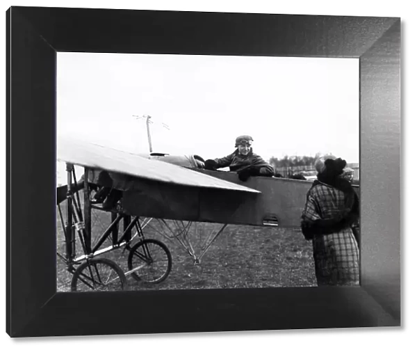 Pioneer British aviator Gustav Hamel pictured in a plane, circa 1913