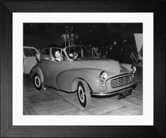 Framed Print : Pat Moss arrives in a Morris Minor 1000 Convertible, for a preview of the 1956 motor Framed Print : Pat Moss arrives in a Morris Minor 1000 Convertible, for a preview of the 1956 motor