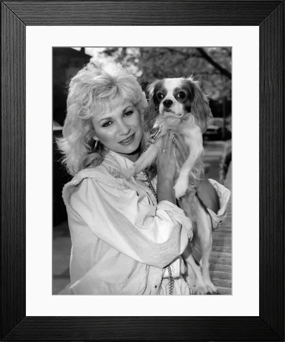 Framed Print : Actress: Debbie Arnold with dog. November 1984 P000683 Framed Print : Actress: Debbie Arnold with dog. November 1984 P000683