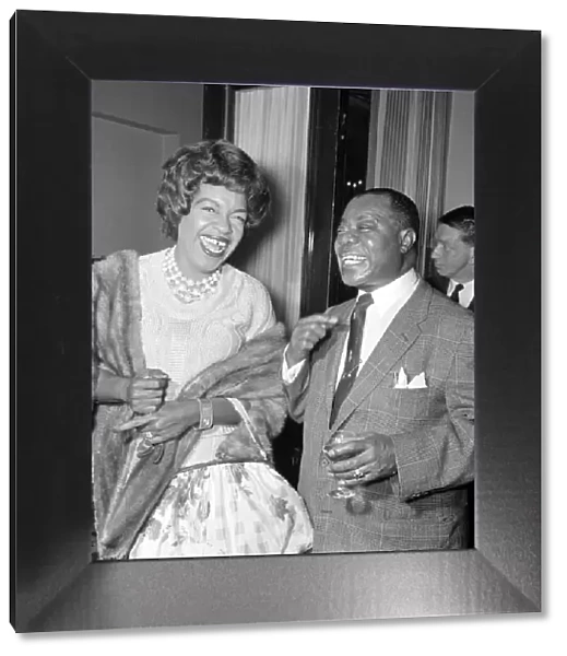Louis Armstrong with Winifred Atwell during the Daily Mirror lunch for Louis Armstrong at