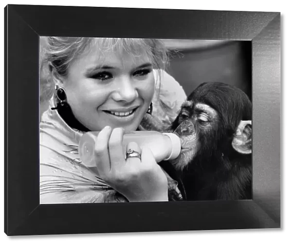 EastEnders star Letitia Dean feeds her adopted baby chimp - Kumi at London Zoo