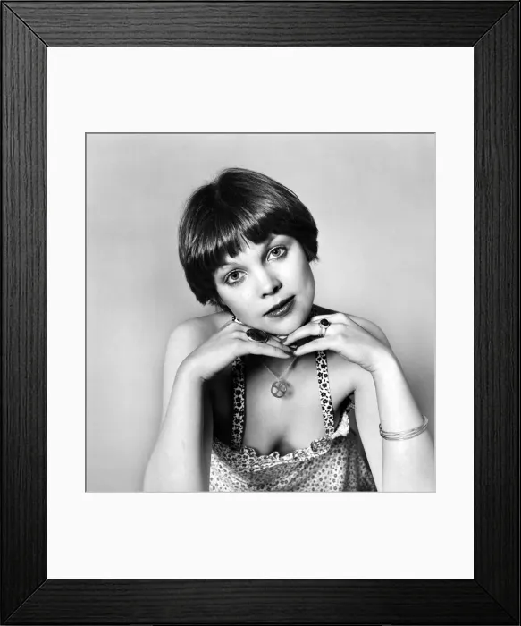 Framed Print : A glamour model posing wearing various items of jewellery including rings