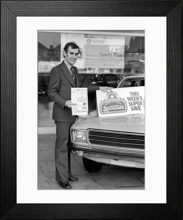 Framed Print : A car dealer putting cars on sale in his garage forecourt. May 1975 Framed Print : A car dealer putting cars on sale in his garage forecourt. May 1975