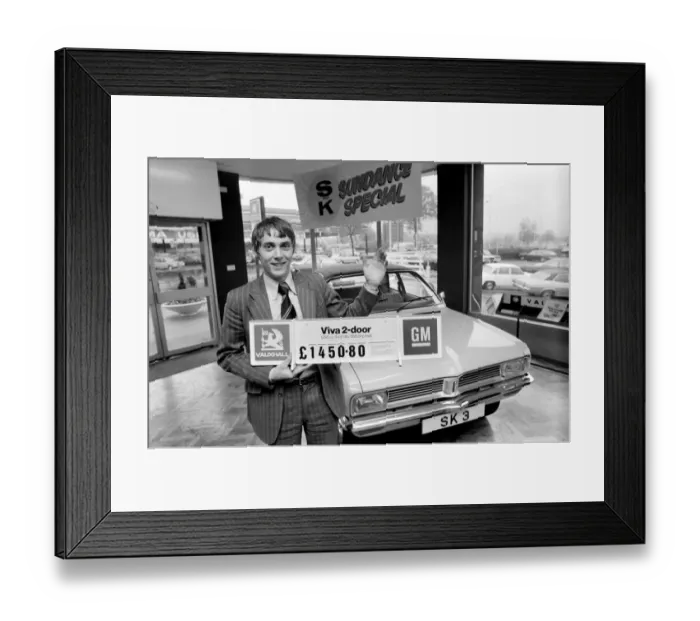 Framed Print : A car dealer putting cars on sale in his garage forecourt in Brighton. May 1975 Framed Print : A car dealer putting cars on sale in his garage forecourt in Brighton. May 1975