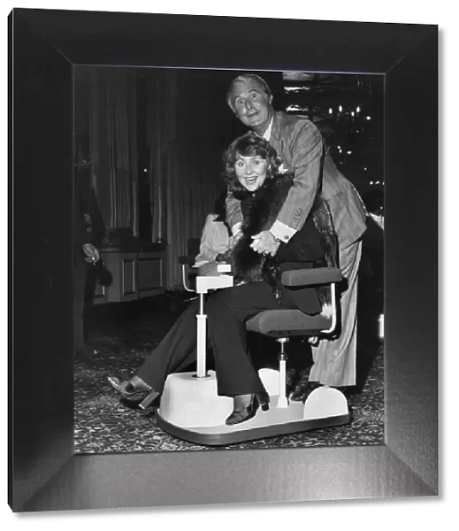 Ernie Wise on one of the Chairmobiles. Ernie Wise with Lulu. April 1979 P035541