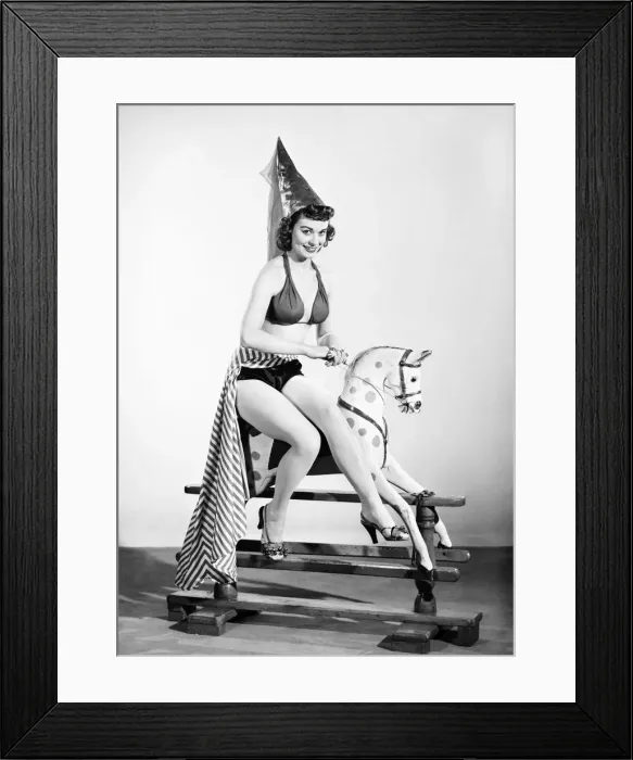 Framed Print : Model dressed as damsel. Riding rocking horse. 1965 E145-006 Framed Print : Model dressed as damsel. Riding rocking horse. 1965 E145-006