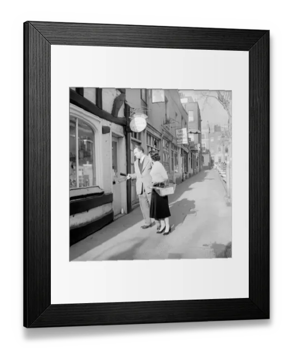 Framed Print : Couple Shopping: Nigel Kneale with his wife Judy Kerr seen here out shopping