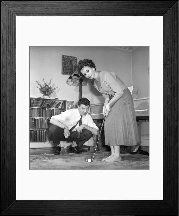 Framed Print : Man, Woman, Golf: Husband tries to teach his wife to putt. March 1950 A217b Framed Print : Man, Woman, Golf: Husband tries to teach his wife to putt. March 1950 A217b