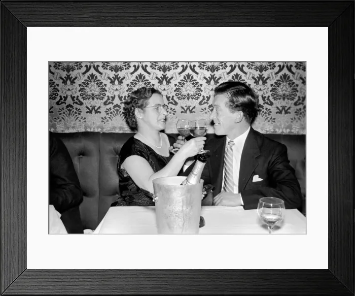 Framed Print : Couple toasting with champaigne Mr. and Mrs. Brown have a celebration drink on their Framed Print : Couple toasting with champaigne Mr. and Mrs. Brown have a celebration drink on their