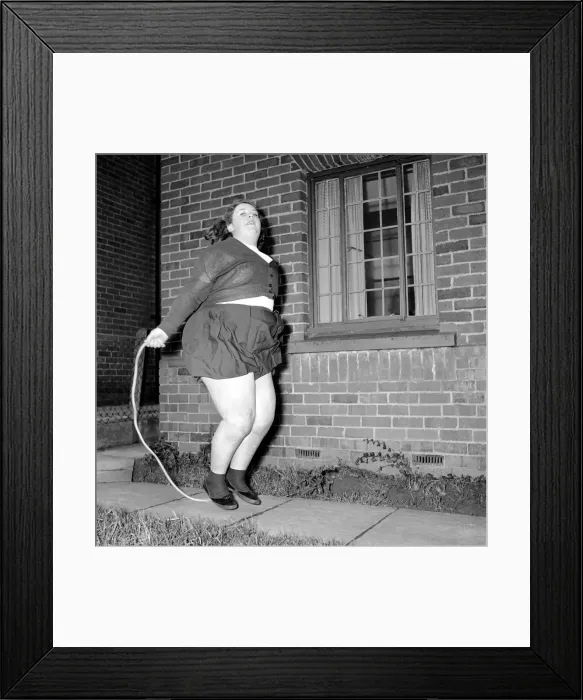 Framed Print : Slimming: Large woman skipping to get fit. A145-001 Framed Print : Slimming: Large woman skipping to get fit. A145-001