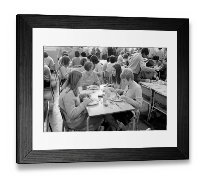 Framed Print : School Dinners. General scenes of school dinner. Ladies serving meal to pupils in