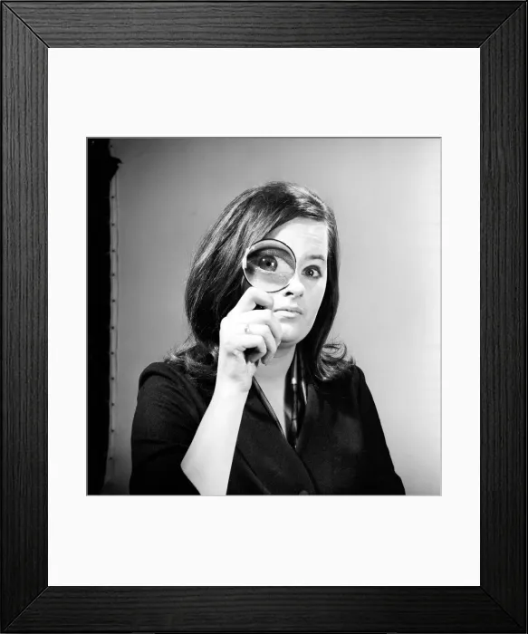 Framed Print : Elementary my dear Watson. Woman holding magnifying glass. Model: Jennie Cropper