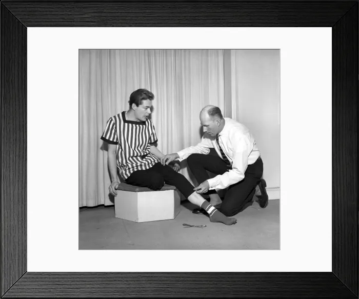 Framed Print : Mens Fashions: Tailor measuring and sewing in his workshop Framed Print : Mens Fashions: Tailor measuring and sewing in his workshop