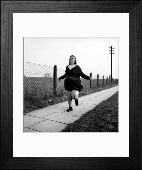 Framed Print : Slimming: Large woman skipping to get fit. A145 Framed Print : Slimming: Large woman skipping to get fit. A145