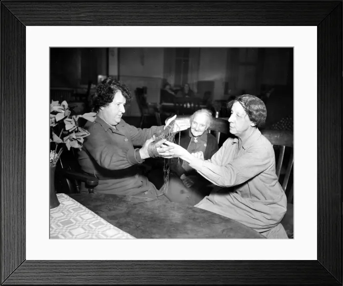 Framed Print : Women winding wool in preparation to knitting at a south coast nursing home. Circa 1953