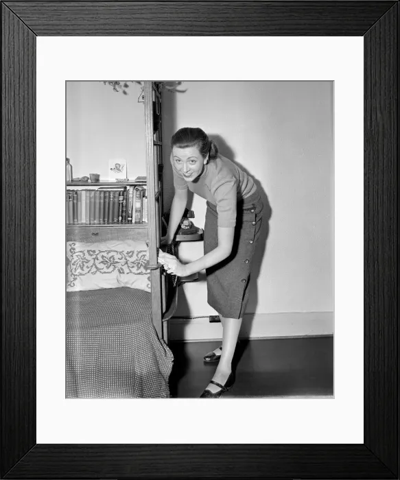 Framed Print : A busy housewife polishing the furniture at home Circa 1954 Framed Print : A busy housewife polishing the furniture at home Circa 1954