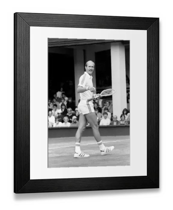Framed Print : Wimbledon 6th Day: McEnroe v. Stan Smith. Stan Smith in action against McEnroe