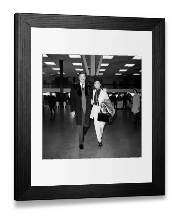 Framed Print : Roger Moore and his wife Luisa left Heathrow Airport with Sir Lew Grade for the Monte Framed Print : Roger Moore and his wife Luisa left Heathrow Airport with Sir Lew Grade for the Monte