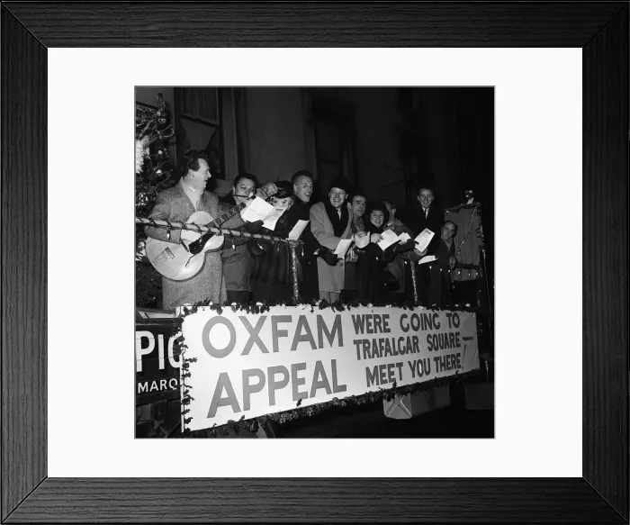 Framed Print : Famous stars did a tour of the West End on a float and ended up singing Christmas Carols