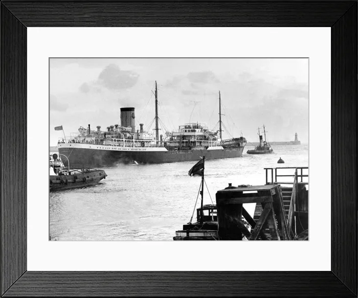 Framed Print : The ship Hyalina makes her past the two piers at the mouth of the River Tyne after