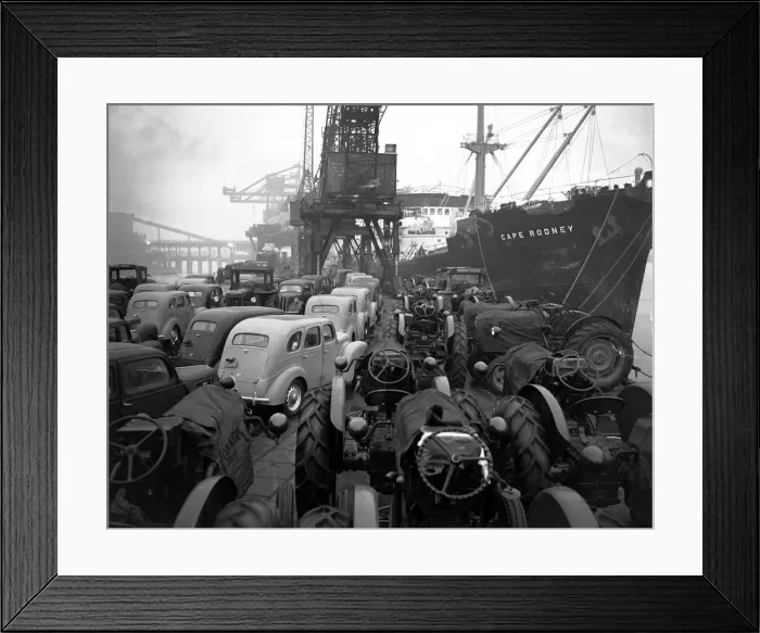 Framed Print : Ford Prefects and Fordson tractors seen here on a Dagenham quayside Framed Print : Ford Prefects and Fordson tractors seen here on a Dagenham quayside