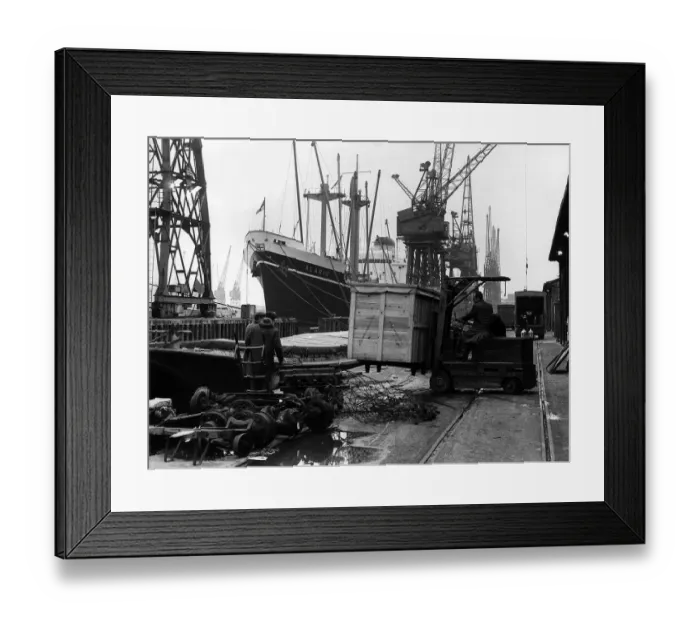 Framed Print : Royal Docks London January 1969 A driver with a fork lift truck moves a wooden Framed Print : Royal Docks London January 1969 A driver with a fork lift truck moves a wooden