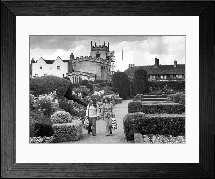 Framed Print : Two patriotic tourists take a stroll through the peaceful surroundings of New Place Framed Print : Two patriotic tourists take a stroll through the peaceful surroundings of New Place