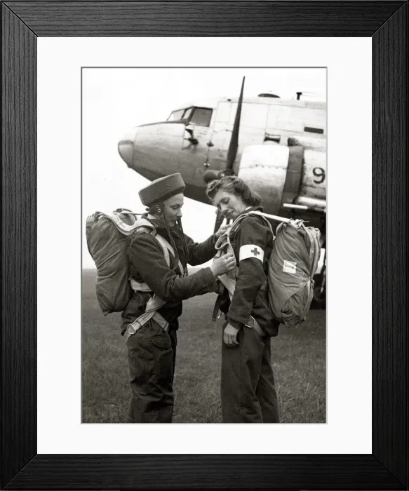 Framed Print : Two members of the Flying Sisters, a new airborne British nursing unit prepare their Framed Print : Two members of the Flying Sisters, a new airborne British nursing unit prepare their