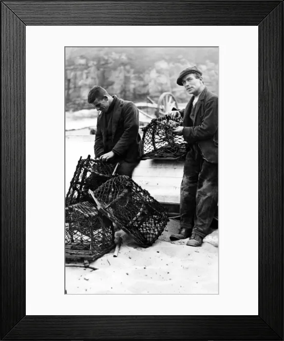 Framed Print : Ravages of the sea. Fishermen repairing crab pots on Tynemouth Haven. 12th September 1936
