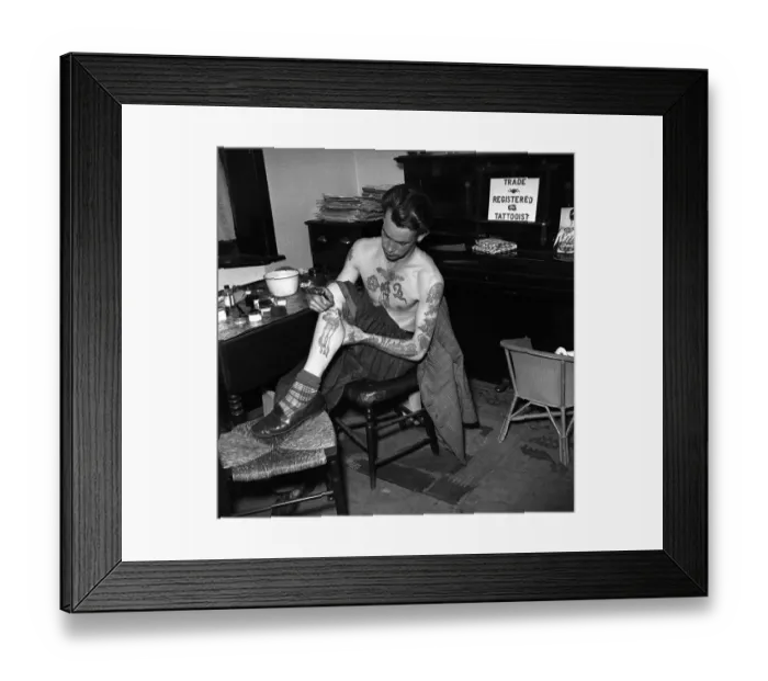 Framed Print : Tattoo artist D. A. Deller seen here at work in his St. Leonards Studio Framed Print : Tattoo artist D. A. Deller seen here at work in his St. Leonards Studio