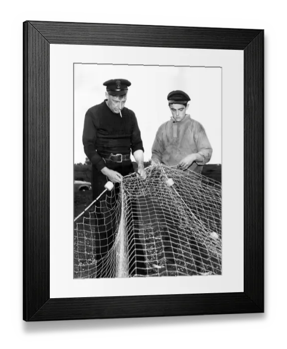 Framed Print : Matthew Stanton and Henry Rowe repairing their fishing net in whcih a whale became Framed Print : Matthew Stanton and Henry Rowe repairing their fishing net in whcih a whale became