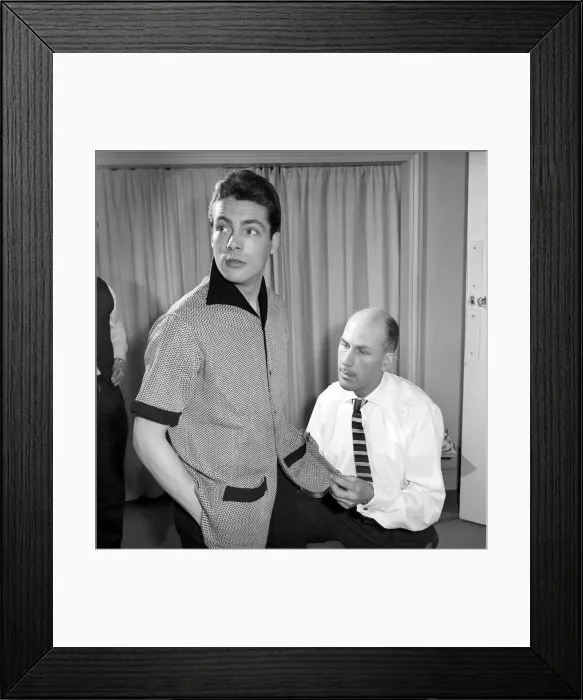 Framed Print : Mens Fashions: Tailor measuring and sewing in his workshop Framed Print : Mens Fashions: Tailor measuring and sewing in his workshop