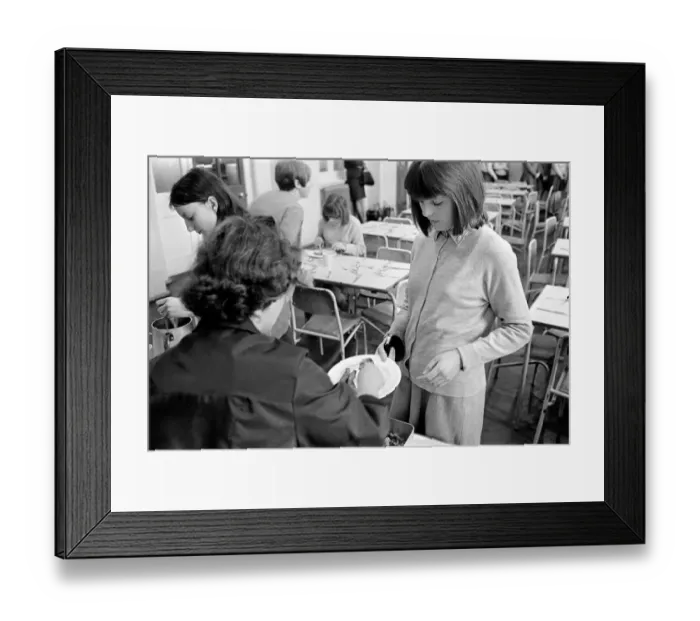 Framed Print : School Dinners. General scenes of school dinner. Ladies serving meal to pupils in