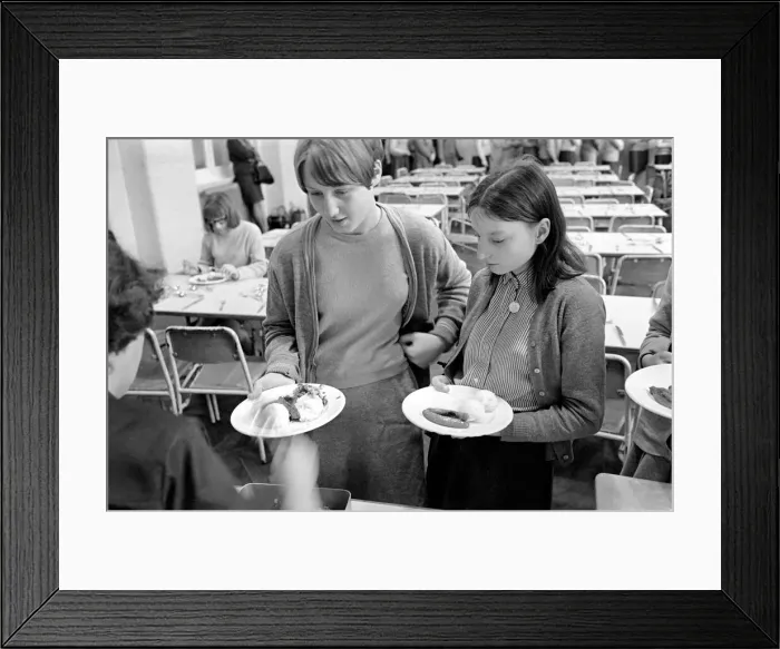 Framed Print : School Dinners. General scenes of school dinner. Ladies serving meal to pupils in Framed Print : School Dinners. General scenes of school dinner. Ladies serving meal to pupils in