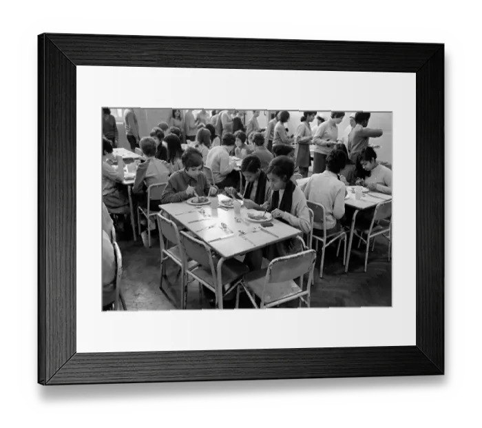 Framed Print : School Dinners. General scenes of school dinner. Ladies serving meal to pupils in