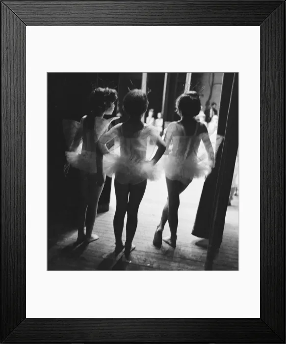 Framed Print : Three young ballerinas look on at the performance of Sleeping Beauty from the wings of Framed Print : Three young ballerinas look on at the performance of Sleeping Beauty from the wings of
