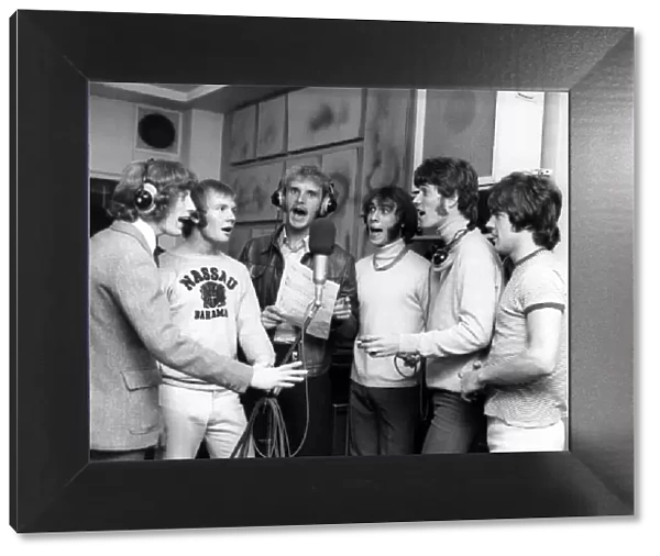 Singing along with tennis ace Ray Moore in the recording studio are Bee Gees Robin Gibb