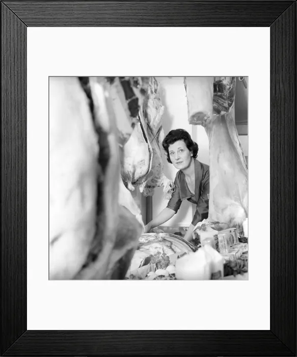 Framed Print : A female butcher seen here at work in her shop. 1963 Framed Print : A female butcher seen here at work in her shop. 1963