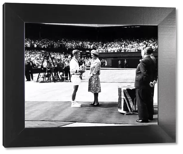 Rod Laver receives the mens trophy from HRH princess Marina July 1961