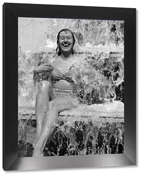 Jean Bentley, 21 year old, of Hammersmith found the right place under the fountain at