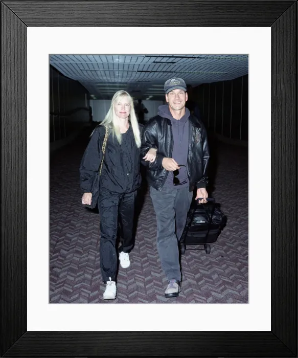 Framed Print : American actor Patrick Swayze with his wife Lisa on arrival at Heathrow Airport