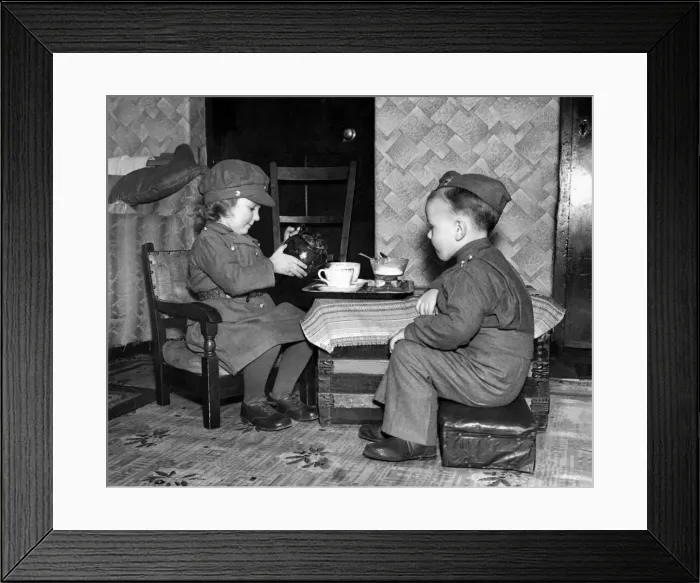 Framed Print : War children A small girl dressed in the uniform of the ATS is seen here Framed Print : War children A small girl dressed in the uniform of the ATS is seen here