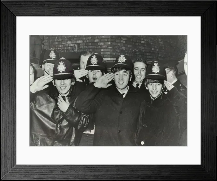 Framed Print : The Beatles clown dressed in policemen helmets used to smuggle them into the Birmingham