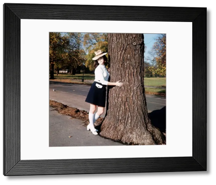 Framed Print : Linda Thorson, Actress, holding a tree trunk Framed Print : Linda Thorson, Actress, holding a tree trunk