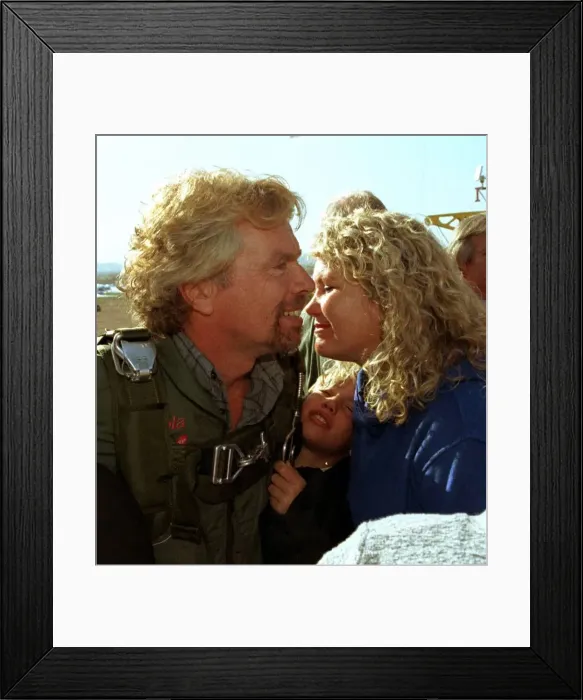 Framed Print : Richard Branson about to board the Virgin Global Challenger balloon is kissed by wife Framed Print : Richard Branson about to board the Virgin Global Challenger balloon is kissed by wife