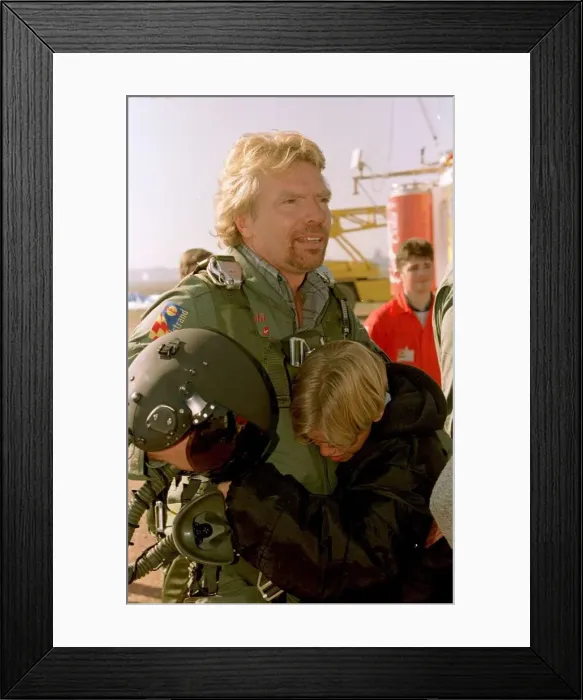 Framed Print : Richard Branson about to board the Virgin Global Challenger balloon is hugged by son Sam